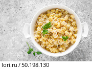 Makaroni po-flotski. Boiled pasta in navy-style with ground chicken meat and fried onions. Стоковое фото, агентство Ingram Publishing / Фотобанк Лори