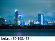 Shenzhen, China - August, 2019: Shenzhen city skyline night scenery, China. Стоковое фото, агентство Ingram Publishing / Фотобанк Лори