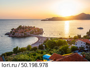 Sveti Stefan Island at Sunset in Montenegro. Стоковое фото, агентство Ingram Publishing / Фотобанк Лори