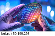 Close-up of a silicon wafer in high-tech lab environment symbolizing semiconductor innovation, chip design and future of computing and AI hardware. Стоковое AI-изображение, AI-художник Igor Tichonow / Фотобанк Лори