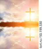 cross silhouette on the mountain at sunset with water reflection. Стоковое фото, агентство Ingram Publishing / Фотобанк Лори