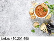 Eggplant hummus with ingredients for cooking. Traditional vegan arabic aubergine appetizer. Baba Ghanoush. Стоковое фото, агентство Ingram Publishing / Фотобанк Лори