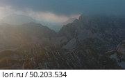 Sunset mountains and dramatic clouds. Стоковое видео, видеограф Михаил Коханчиков / Фотобанк Лори