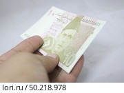 10 rupees Pakistani currency note. Редакционное фото, агентство Ingram Publishing / Фотобанк Лори