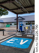 EV Station Charger for electrical vehicle car using as green environmental concept. Стоковое фото, агентство Ingram Publishing / Фотобанк Лори