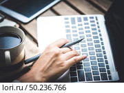 The business man working with high technology for benefit graph increasing. Стоковое фото, агентство Ingram Publishing / Фотобанк Лори