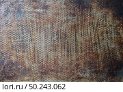 Scratched bottom of an old oven baking tray as a creative background. Copy space.. Background of old oven tray. Стоковое фото, агентство Ingram Publishing / Фотобанк Лори