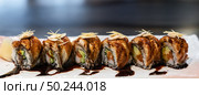 Traditional japanese food cuisine Unagi roll, japanese ell serve with japanese rice and avocado with special sauce. Panorama crop for web banner. Стоковое фото, агентство Ingram Publishing / Фотобанк Лори