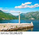 Lighthouse on island Lady of the Rocks. Lighthouse on the artificially built island of Our Lady on the Rock near Perast, Montenegro. Стоковое фото, агентство Ingram Publishing / Фотобанк Лори