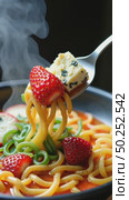 A close-up of a spoon dipping into a bowl of ramen topped with unexpected ingredients blue cheese, pickled strawberries. Concept of unusual food. Стоковое AI-видео, аниматор Sergey Grishin / Фотобанк Лори