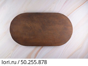 Top view of wooden cutting board on a gray marble background with space for text. Стоковое фото, агентство Ingram Publishing / Фотобанк Лори