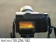 Camera shooting at sunset. Element of design. Стоковое фото, агентство Ingram Publishing / Фотобанк Лори