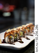 Traditional japanese food cuisine Unagi roll, japanese ell serve with japanese rice and avocado with special sauce. Стоковое фото, агентство Ingram Publishing / Фотобанк Лори