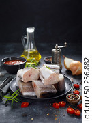 Raw fresh sliced hake fish with ingredients for cooking. Стоковое фото, агентство Ingram Publishing / Фотобанк Лори