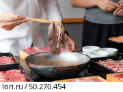 Cooking of japanese wagyu beef Shabu Shabu set hot pot. Стоковое фото, агентство Ingram Publishing / Фотобанк Лори