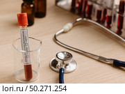 blood test result for the new rapidly spreading Coronavirus, originating in Wuhan, China. Стоковое фото, агентство Ingram Publishing / Фотобанк Лори
