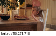Children Drinking Juice on a Birthday Party at Home. Siblings, girls and a boy together celebrating a party, eating cake sitting at festive table. Little Kid Celebration. Surprise. Low key. Стоковое видео, видеограф Марина Демидюк / Фотобанк Лори