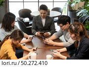 Young unemployed people concept, checking job on smartphone. Стоковое фото, агентство Ingram Publishing / Фотобанк Лори
