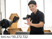 Young male vlogger live vlog video for selling online. online marketing concept. Стоковое фото, агентство Ingram Publishing / Фотобанк Лори