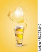 Big heart splash of light amber beer above full glass of fresh beverage with thick foam on a light yelow background, copy space.. Heart splash of light beer above full glass of fresh beverage. Стоковое фото, агентство Ingram Publishing / Фотобанк Лори