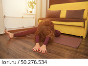 Morning Yoga Session for Flexibility and Mental Focus at Home. Стоковое фото, фотограф Aleksandr Golubev / Фотобанк Лори