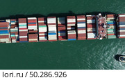 Cargo ship filled with containers in port area. Стоковое фото, фотограф Михаил Коханчиков / Фотобанк Лори