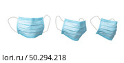Set from three medical antibacterial blue face masks for protection from viruses on a white background, copy space. Concept of prevention from respiratory sickness and infections.. Medical masks set for protection on a black background. Стоковое фото, агентство Ingram Publishing / Фотобанк Лори