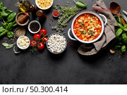 Cooking pasta e fagioli soup with chicken meat and vegetables, italian cuisine. Стоковое фото, агентство Ingram Publishing / Фотобанк Лори