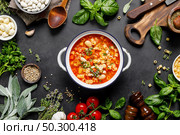 Cooking pasta e fagioli soup with chicken meat and vegetables, italian cuisine. Стоковое фото, агентство Ingram Publishing / Фотобанк Лори