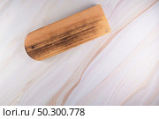 Top view of wooden cutting board on a gray marble background with space for text. Стоковое фото, агентство Ingram Publishing / Фотобанк Лори