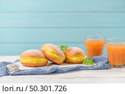 Bolas de Berlim, or "Berlin Balls". Portuguese fried dough with sugar, Filled with sweet egg cream. Стоковое фото, агентство Ingram Publishing / Фотобанк Лори