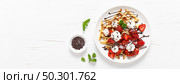 Belgian waffles with fresh strawberry, chocolate topping and whipped cream. Banner. Стоковое фото, агентство Ingram Publishing / Фотобанк Лори