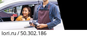 Asian woman make mobile payment contactless technology for online grocery ordering and drive thru service. Drive through is popular after pandemic. Panorama web banner with free copyspace for editing. Стоковое фото, агентство Ingram Publishing / Фотобанк Лори