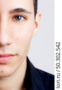 Fashion portrait of a young man with blue eyes - OBS: model use lens contact. Стоковое фото, агентство Ingram Publishing / Фотобанк Лори