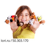 Cute and happy girl playing with finger puppets. Стоковое фото, агентство Ingram Publishing / Фотобанк Лори