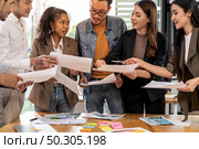 Interracial asian business team brainstorming idea talk and discuss at office meeting room after reopen due to coronavirus COVID-19 city lockdown. Business startup meeting and brainstorm concept. Стоковое фото, агентство Ingram Publishing / Фотобанк Лори
