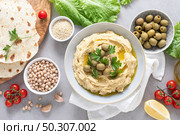 Chickpea hummus with green olives. Стоковое фото, агентство Ingram Publishing / Фотобанк Лори