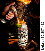 flamed cocktail with ice and fruits. Стоковое фото, агентство Ingram Publishing / Фотобанк Лори