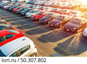Dealer New Cars Stock. Colorful Brand New Compact Vehicles For Sale Awaiting on the Dealer Parking Lot. Car Market Business Concept. Стоковое фото, агентство Ingram Publishing / Фотобанк Лори