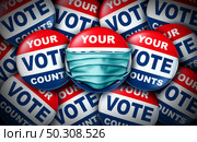 Voting during a pandemic and your vote counts election badge as a United States democratic right for voters concept for a political campaign with a campaign button with a face mask as a 3D illustration. Стоковое фото, агентство Ingram Publishing / Фотобанк Лори