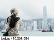 people sitting alone at the view of Hong Kong. Стоковое фото, агентство Ingram Publishing / Фотобанк Лори