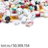 packings of pills and capsules of medicines on white background. Стоковое фото, агентство Ingram Publishing / Фотобанк Лори