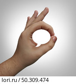 Body language concept and non-verbal or nonverbal communication with a hand making a gesture shaped as a word or speech bubble or deaf culture with fingers communicating in a silent voice. Стоковое фото, агентство Ingram Publishing / Фотобанк Лори
