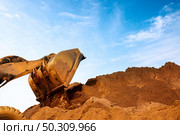 Close-up of a construction site excavator. Стоковое фото, агентство Ingram Publishing / Фотобанк Лори