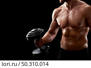 Ready for a challenge. Cropped closeup shot of a shirtless fitness man with perfect body working out holding a dumbbell. Young fitness man in studio. Стоковое фото, агентство Ingram Publishing / Фотобанк Лори