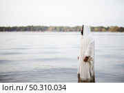 A biblical scene - of Jesus Christ standing in the water with a blurred background. Biblical scene - of Jesus Christ standing in the water with a blurred background. Стоковое фото, агентство Ingram Publishing / Фотобанк Лори