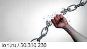 Liberty concept and freedom metaphor as a symbol of liberation and as an idea of chains breaking as a human fist breaking free with 3D illustration elements. Стоковое фото, агентство Ingram Publishing / Фотобанк Лори