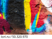 Vibrant Graffiti Wall with Neon Blue, Red, Yellow for Urban Street Art, 2000s Aesthetic. Стоковое фото, фотограф Александра Конопля / Фотобанк Лори