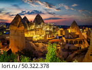 Goreme town on sunset in Cappadocia, Central Anatolia,Turkey. Стоковое фото, агентство Ingram Publishing / Фотобанк Лори