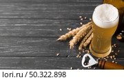 above view glass of beer with foam. Стоковое фото, агентство Ingram Publishing / Фотобанк Лори